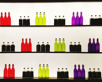Multi colored bottles on shelf