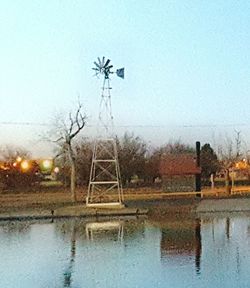 Scenic view of wet landscape against sky during winter