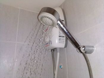 Close-up of faucet in bathroom