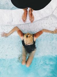 High angle view of woman swimming in pool