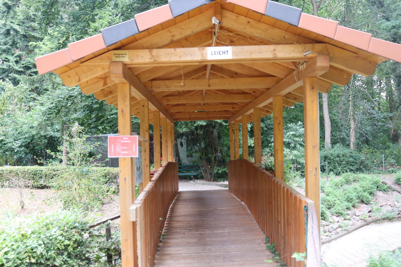 VIEW OF FOOTBRIDGE LEADING TOWARDS TREES