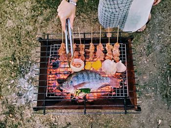 High angle view of person on barbecue grill
