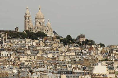 Buildings and basilique du sacre coeur against clear sky