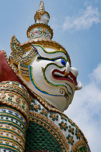 Low angle view of statue against sky