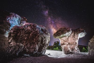 Low angle view of mountain against sky at night