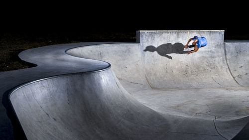 Man practicing inline skating at skateboard park