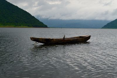 Boat in sea against sky