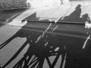 High angle view of shadow of bicycle on street