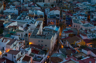 High angle view of illuminated buildings in city
