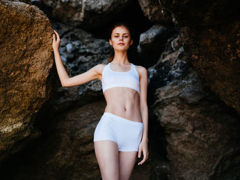 Full length of woman standing on rock