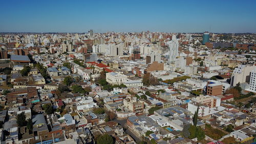 Aerial view of cityscape against clear sky