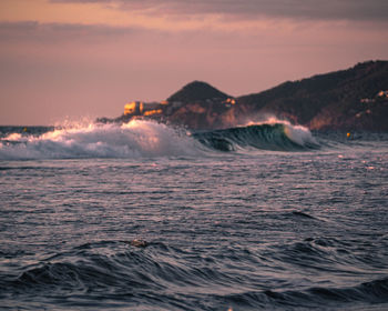 Scenic view of sea against sky at sunset