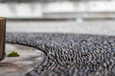 Close-up of pebbles on footpath