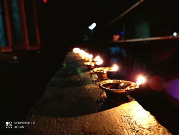 High angle view of illuminated candles