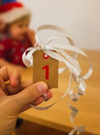 Close-up of hand holding christmas decoration