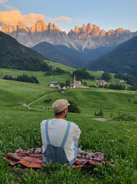 Rear view of woman looking at field