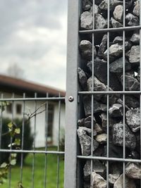 Close-up of metal structure against sky