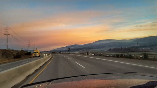 Road against sky during sunset