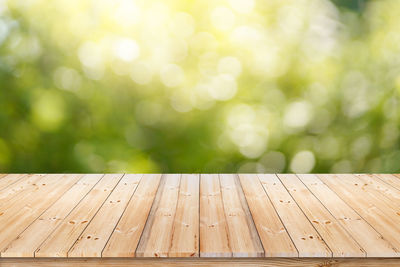 Close-up of wooden bench on table