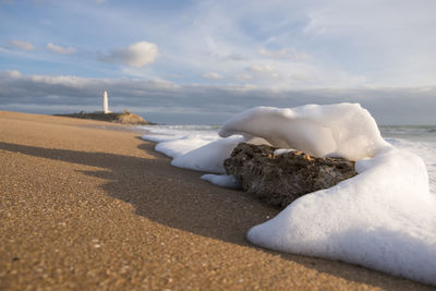 Scenic view of sea against sky during winter