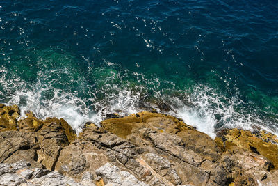 Sea waves splashing on rocks