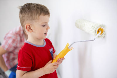 Close-up of boy holding dental equipment