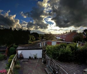 View of storm clouds over buildings