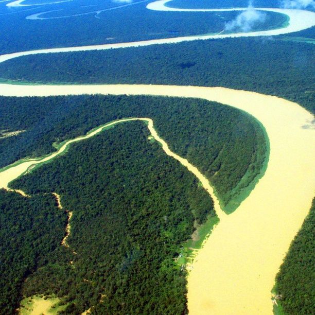 high angle view, tranquility, water, tranquil scene, transportation, nature, aerial view, scenics, landscape, beauty in nature, road, day, sand, blue, sunlight, outdoors, sea, no people, green color, beach