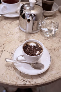 High angle view of coffee cup on table