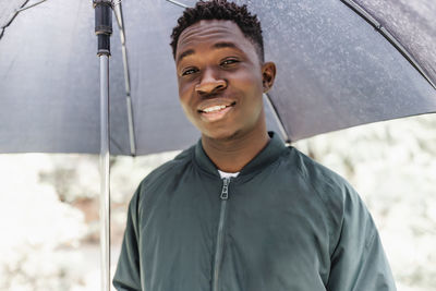 Young man with umbrella
