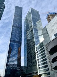 Low angle view of modern buildings against sky