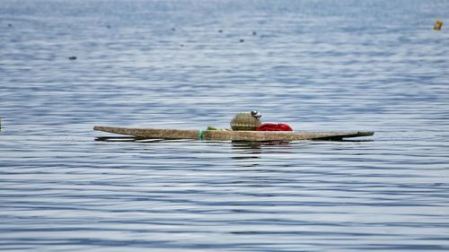 Boat floating on lake