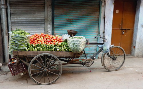 Bicycles on cart against building