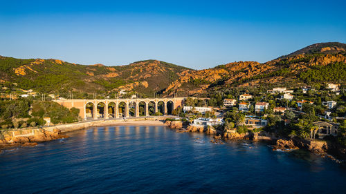 Bridge over river against clear sky