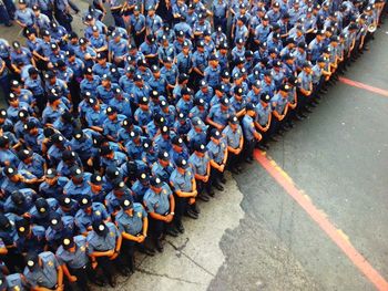 High angle view of police officers standing on road