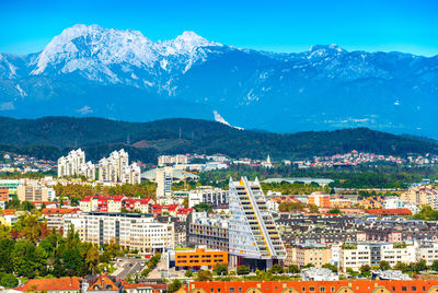 High angle view of townscape and mountains against sky