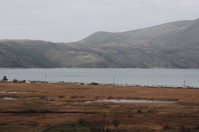 Scenic view of landscape and mountains against sky