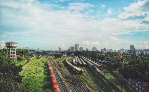 High angle view of train in city against sky