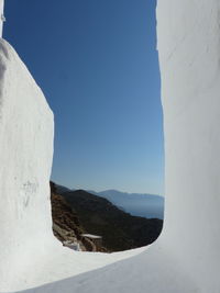 Scenic view of mountains against clear blue sky