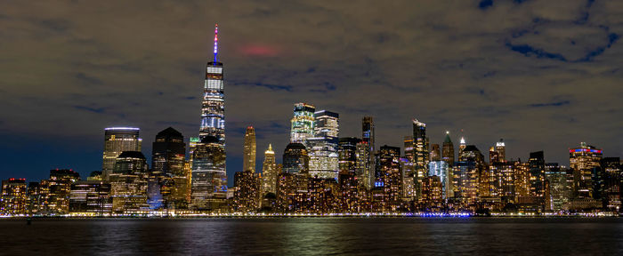 Illuminated buildings in city at night