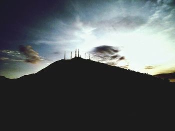 Low angle view of silhouette mountain against sky