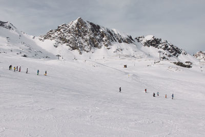 Group of people on snow covered landscape