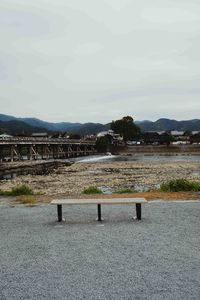 Bridge over mountain against sky