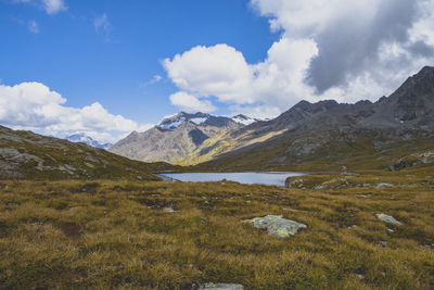 Scenic view of mountains against cloudy sky