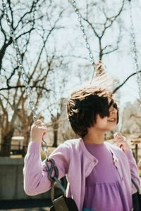 Close-up of woman holding hair