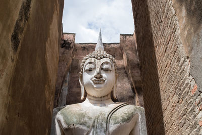 Statue of buddha against sky