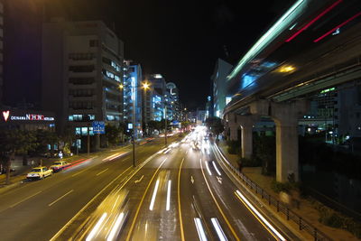 Illuminated city street at night