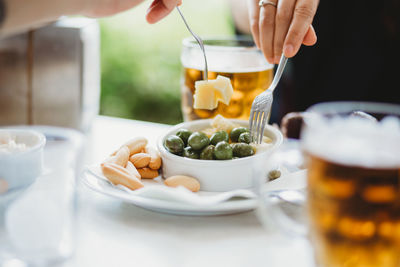 Cropped image of person preparing food on table