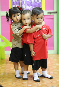 Full length portrait of cute siblings