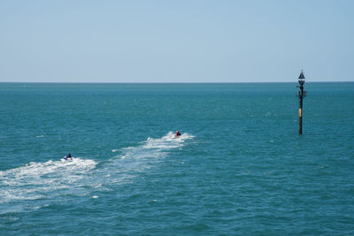 Scenic view of sea against clear sky